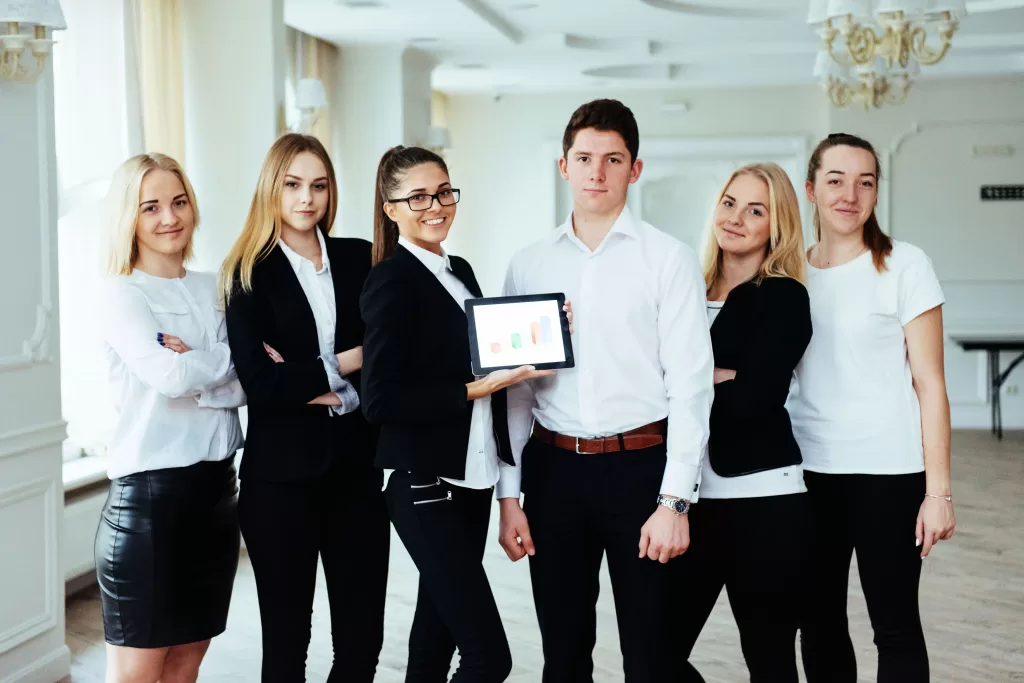 A corporate training session in progress in the Philippines, led by an expert trainer, with engaged employees learning new skills in a professional setting.